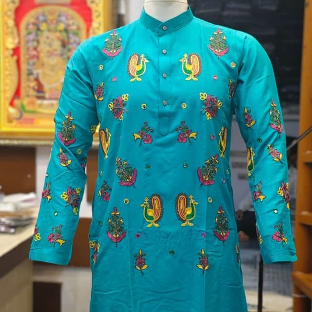 Turquoise blue base with multicolored embroidery including pink, yellow, green, and orange Kurta