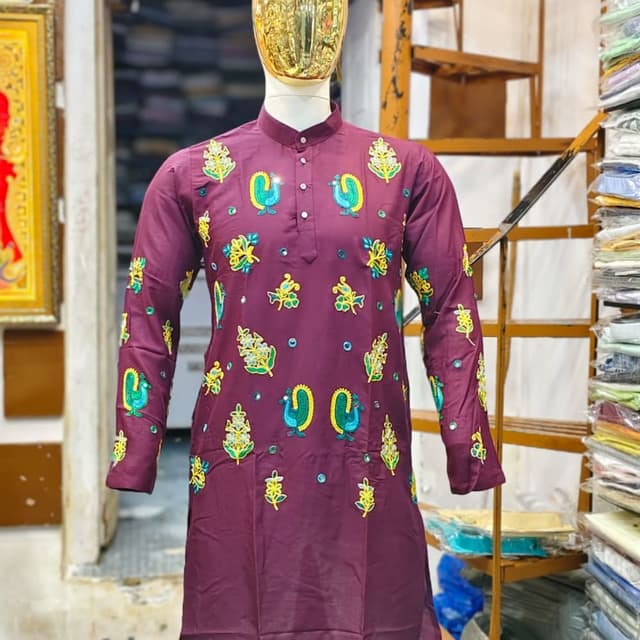 Deep maroon base with vibrant yellow, lime green, and turquoise blue embroidery Kurta