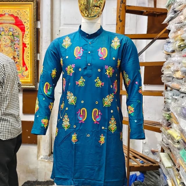 Teal base with multi-colored embroidery including pink, yellow, green, and white Kurta