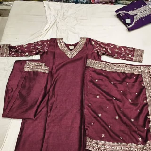 Deep maroon or wine red with metallic silver embellishments Salwar Kameez Set