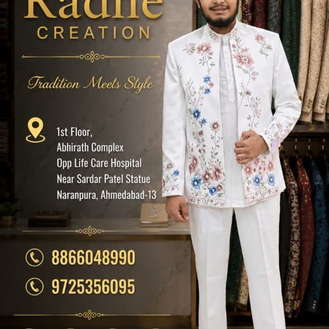 White base with multi-colored floral embroidery (pinks, blues, greens) Jodhpuri Suit
