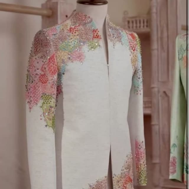 Off-white base with multicolor pastel accents including pink, green, yellow, and blue Bandhgala or Jodhpuri Jacket