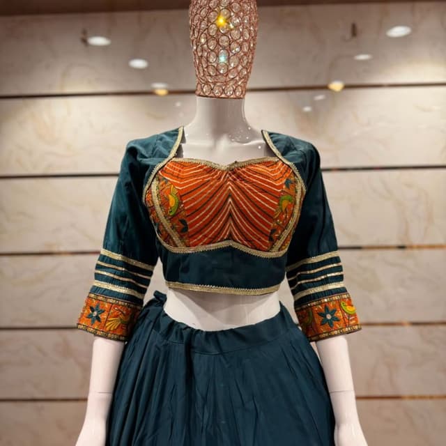 Dark emerald green and vibrant burnt orange with gold accents Lehenga Choli