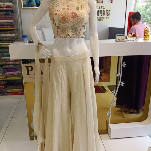 Off-white, cream, gold, peach, and green accents Lehenga Choli / Crop Top and Skirt Set
