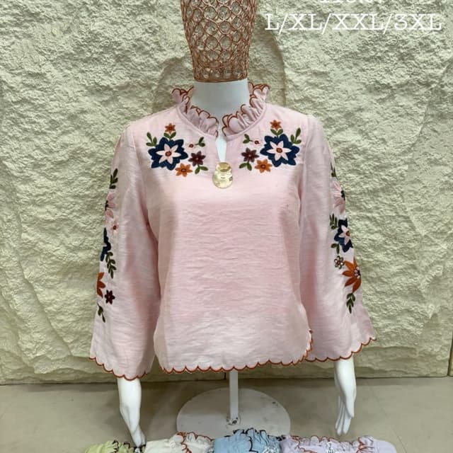 Light pink base with navy, orange, and olive green embroidery Top