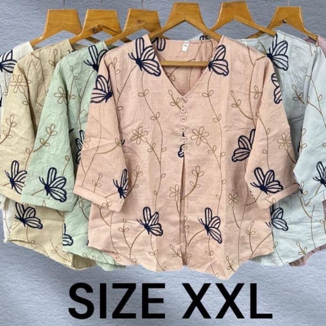 Soft peach-pink base with navy blue and olive green embroidery Top