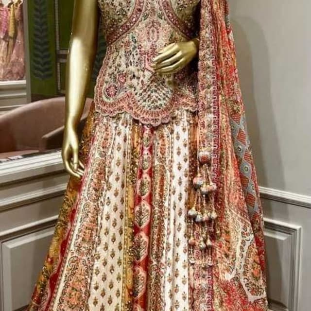 Red, orange, beige, and gold tones Lehenga Choli
