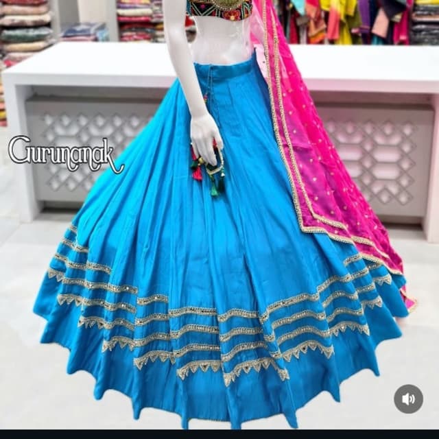Bright blue base with pink, gold, and multi-colored embroidery Lehenga Choli