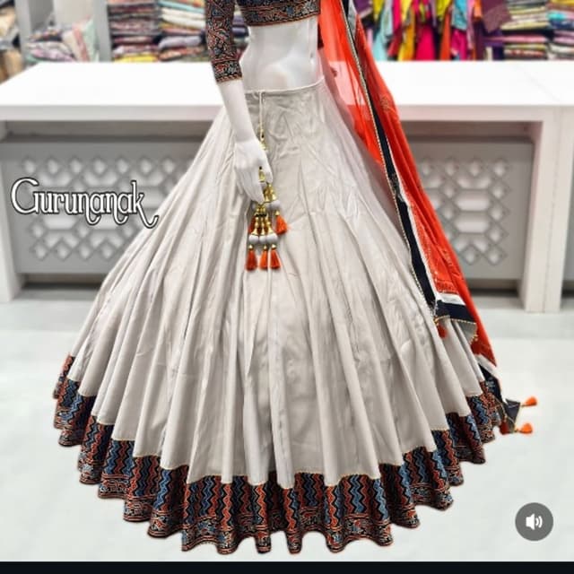 Off-white, deep navy blue, terracotta orange, and rust Lehenga Choli