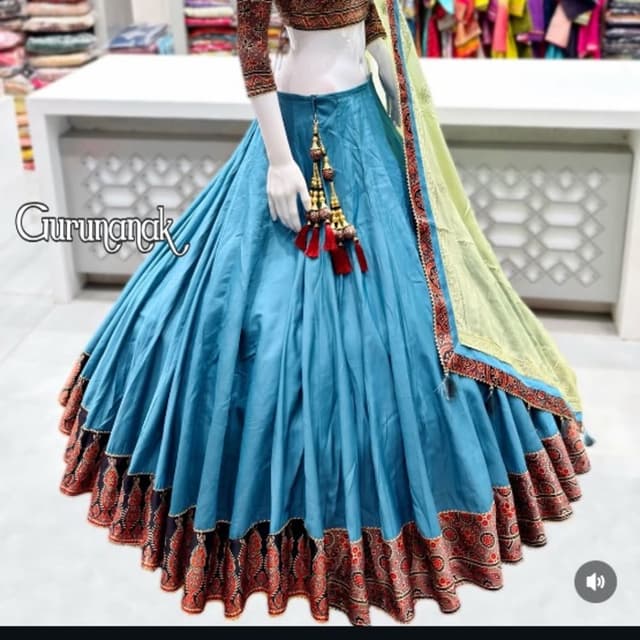 Peacock blue, black, rust, orange, and pale lime green Lehenga Choli