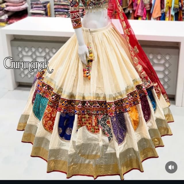 Off-white base with multicolor patches (red, blue, yellow, green) and gold accents Lehenga Choli