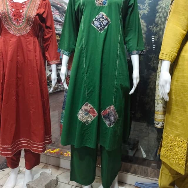 Emerald green with multi-colored patch fabric accents in blue, maroon, and white Kurta Set