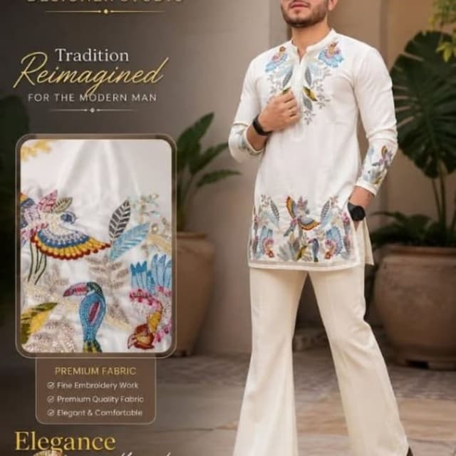 Off-white base with multi-colored embroidery (blues, reds, yellows, greens) Kurta Set