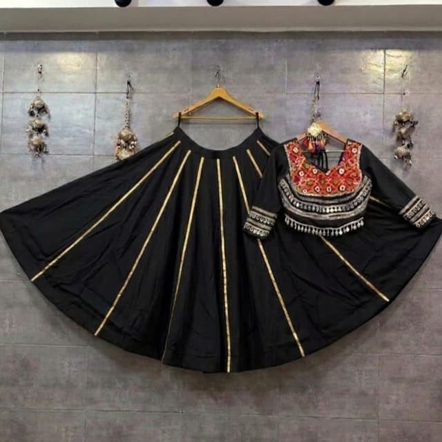 Black with gold accents and multi-colored embroidery on the blouse Lehenga Choli