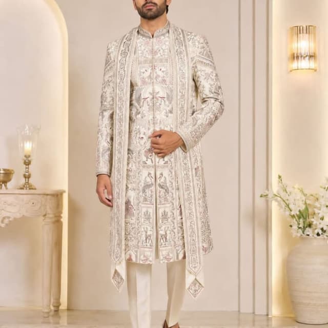 Off-white, cream, and muted earth tones with subtle metallic accents Sherwani