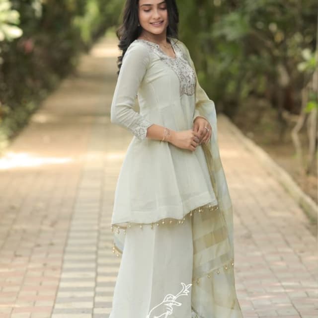 Off-white, cream, and subtle gold accents Peplum Kurta and Palazzo Set