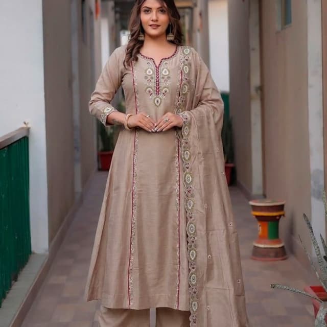 Beige or light tan with subtle maroon piping and multi-colored embroidery Salwar Kameez Set