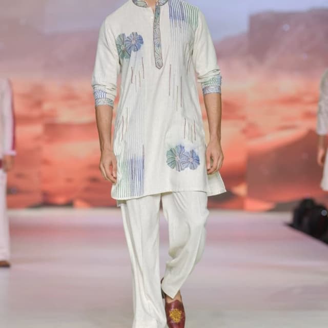 Off-white base with blue, green, and hints of red embroidery Kurta Pajama