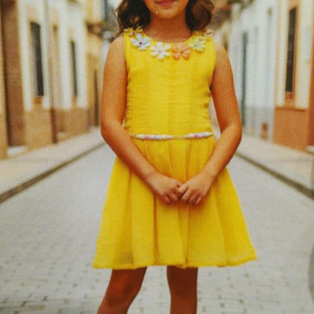 Bright yellow, with multi-colored accents on the collar and waist Dress