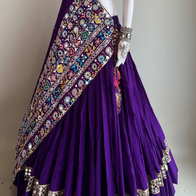 Deep purple base with multi-colored embroidery and gold accents Lehenga Choli