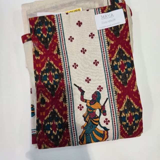 Off-white base with deep red, mustard yellow, teal, and charcoal grey accents Unstitched Dress Material