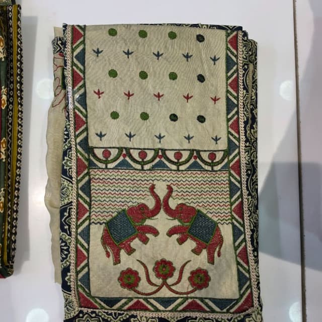 Off-white base with accents of red, navy blue, and green Dress Material or Dupatta