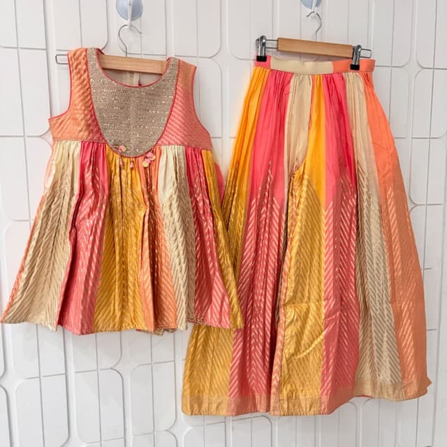 Coral pink, vibrant yellow, and beige with metallic gold accents Lehenga Choli