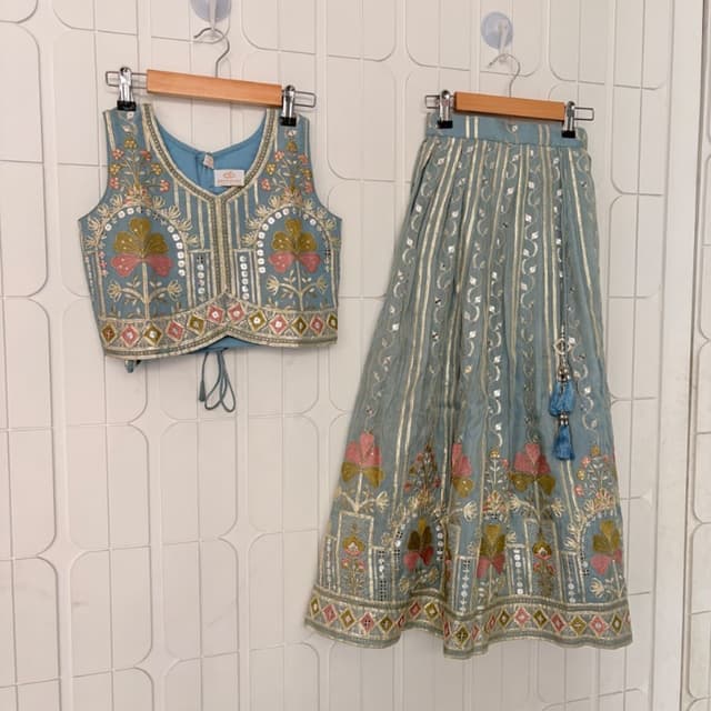 Dusty blue, soft pink, golden yellow, and metallic gold Lehenga Choli