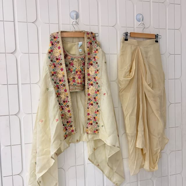 Beige/Cream base with multi-color floral embroidery (red, yellow, green, pink) and gold metallic accents Dhoti pant and crop top set with long jacket
