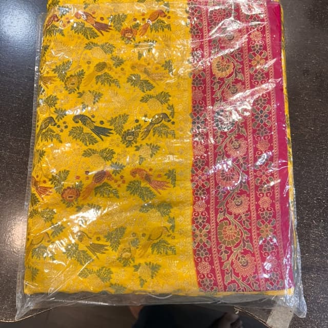 Yellow base with hot pink border and multi-colored zari work Saree