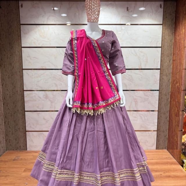 Mauve-purple base with vibrant fuchsia pink dupatta and multicolored geometric borders Lehenga Choli