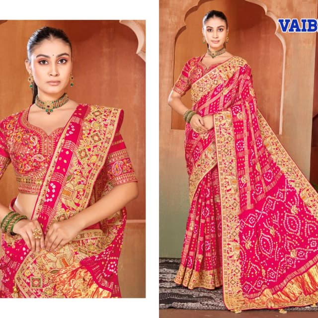 Vibrant pink base with gold and multi-colored embroidery Saree