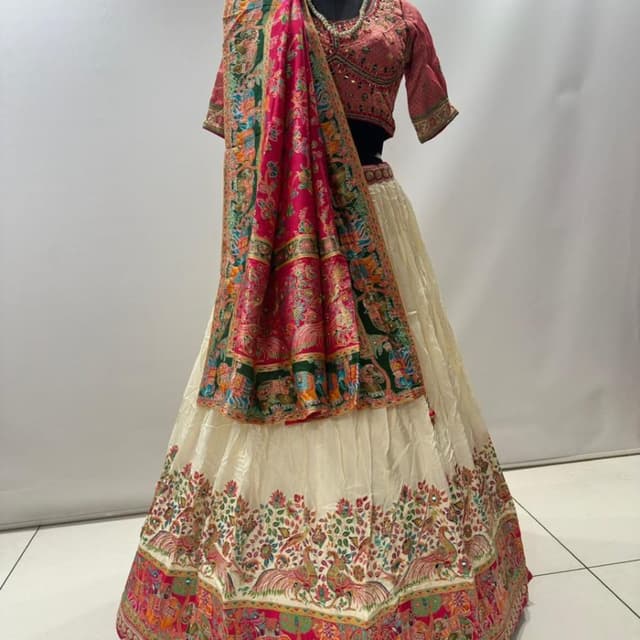 Off-white, Deep Pink, Emerald Green, Multi-colored accents Lehenga Choli