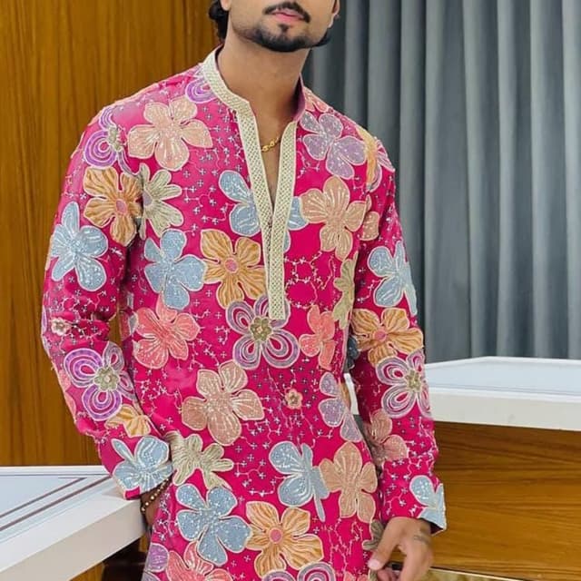 Hot pink base with multi-colored floral embroidery in pale blue, beige, and lilac Kurta