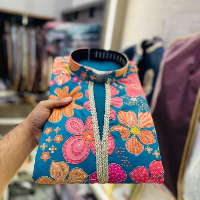 Teal blue base with orange, bright pink, and gold accents Kurta
