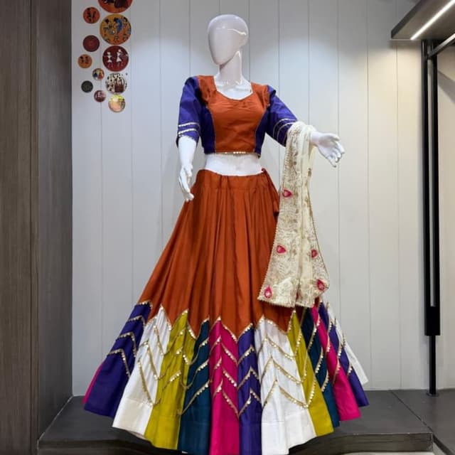 Burnt orange, royal blue, mustard yellow, teal, magenta, and off-white Lehenga Choli
