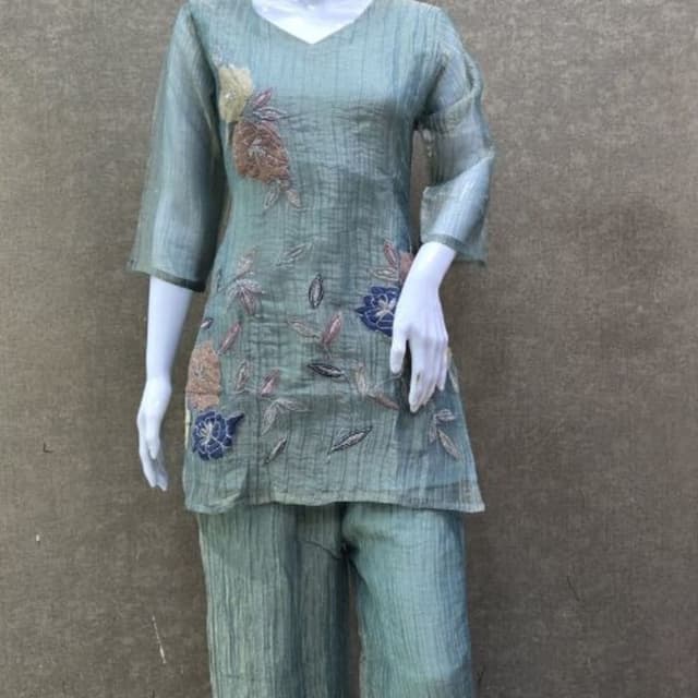 Sage green base with floral accents in navy blue, peach, and muted brown Co-ord set (Tunic and pants)