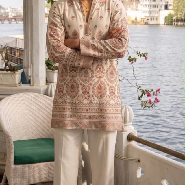 Off-white base with multicolor prints including dusty pink, sage green, and hints of rust orange Kurta