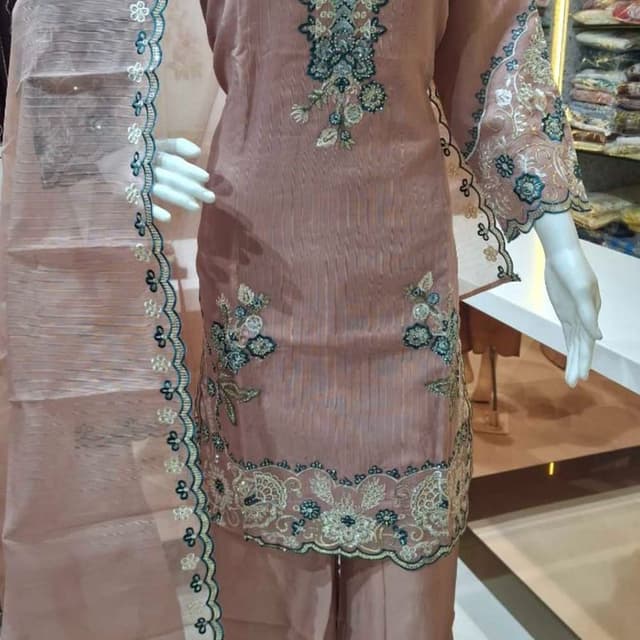 Dusty rose or mauve pink with teal and off-white accents Salwar Kameez Suit
