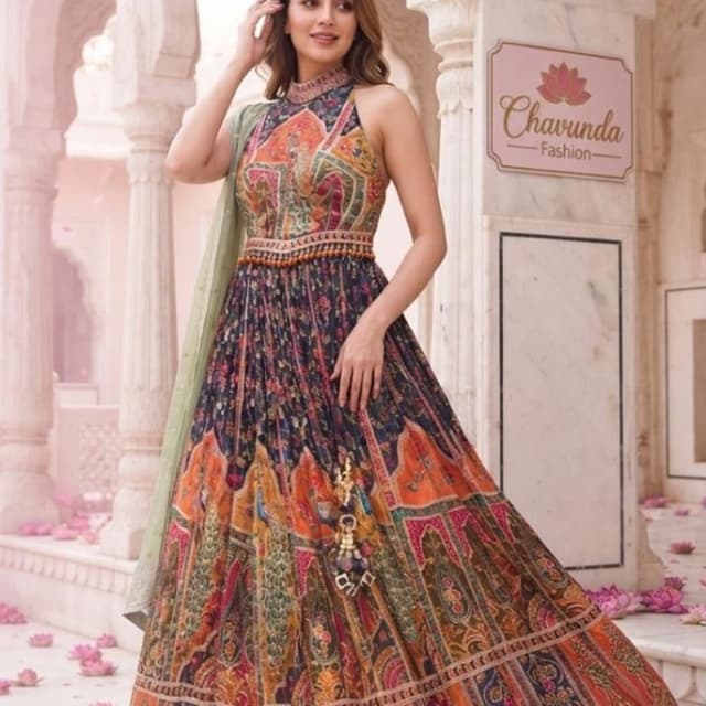 Multi-colored, featuring navy blue, orange, mustard yellow, and pink, with a sage green dupatta. Lehenga Choli