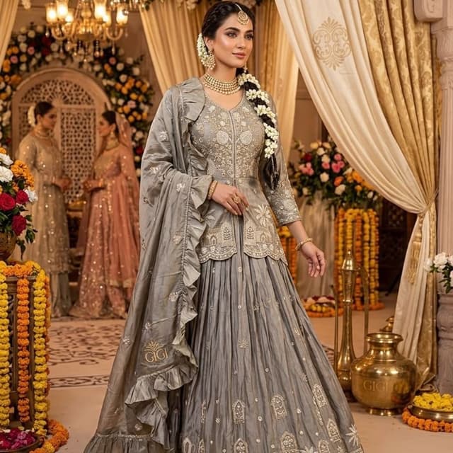 Monochromatic silver-grey Lehenga Choli with peplum top and ruffled dupatta