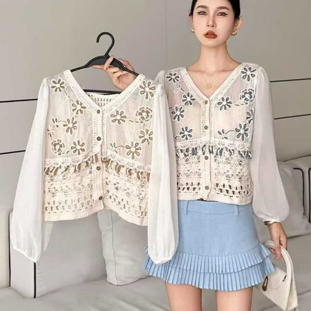 Off-white or cream with subtle embroidery tones Blouse