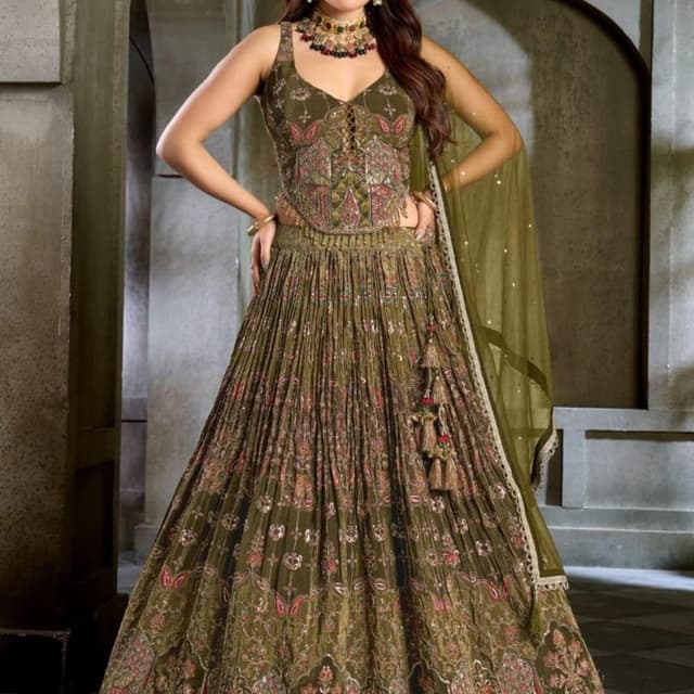 Olive green base with accents of pink, gold, and cream Lehenga Choli