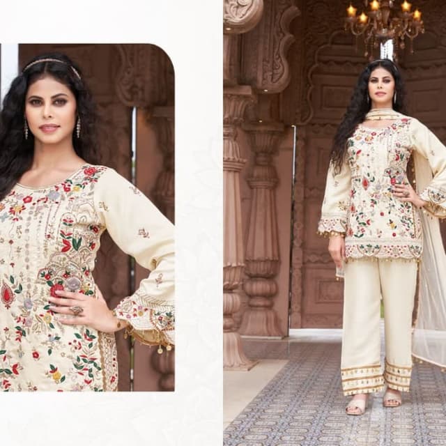 Cream base with multi-colored embroidery including red, green, and gold accents Kurta / Tunic