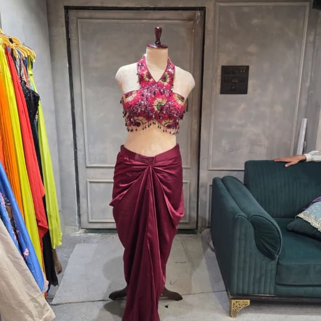 Deep maroon, fuchsia, dark green, and metallic tones Lehenga Choli set (Halter neck blouse and draped skirt)