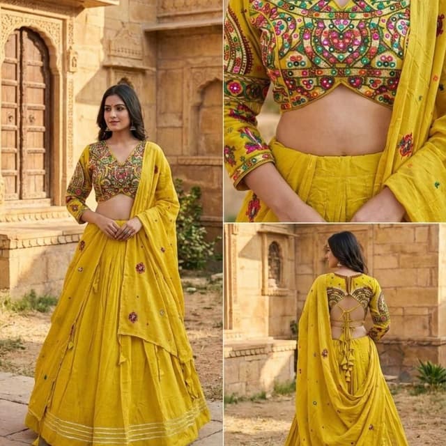 Vibrant Mustard Yellow base with multicolored embroidery including pink, green, orange, and blue accents Lehenga Choli