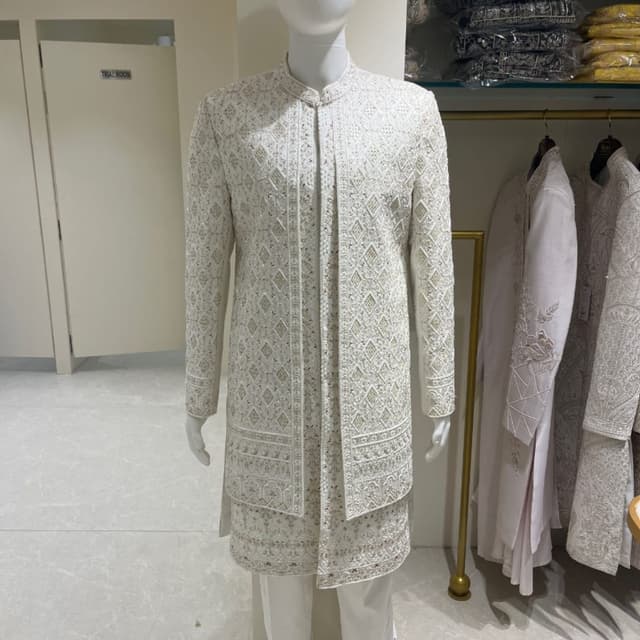 Off-white and ivory with subtle metallic hints Sherwani