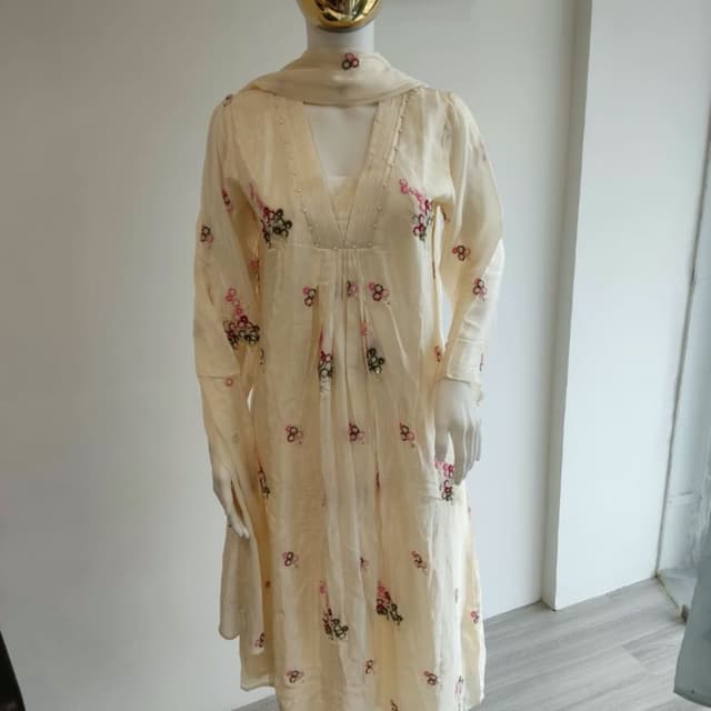 Off-white or cream base with pink, red, and green floral accents Kurta Set with Dupatta