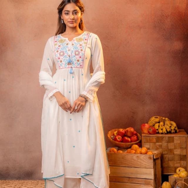 White base with multicolor embroidery (pink, blue, yellow) and turquoise accents Kurta set with palazzo pants and dupatta