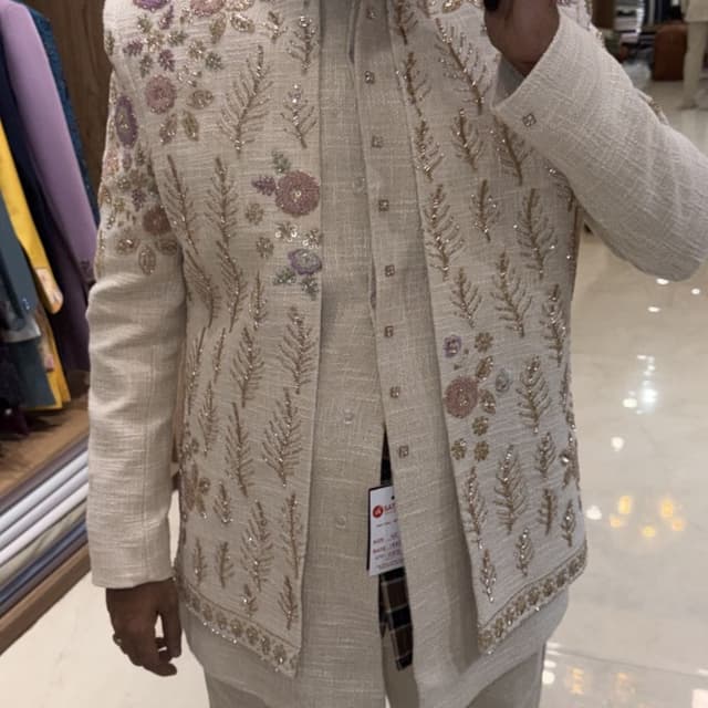 Off-white, cream, with accents of pastel pink and lilac Jodhpuri Jacket and Trousers set
